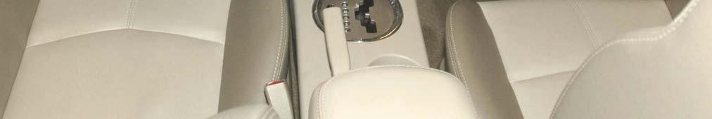 5. Starting at the bottom edge of the HVAC control knob center bezel, use a plastic trim stick to