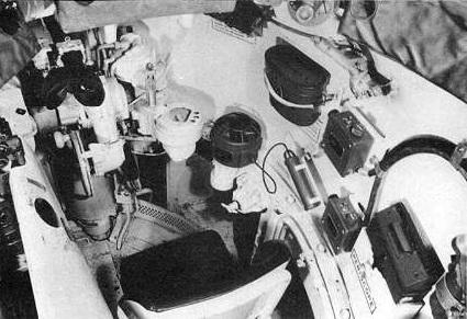 The commander's lower seat is at the lower left, and the loader's seat located on the left side of the turret is seen at the top of the picture.