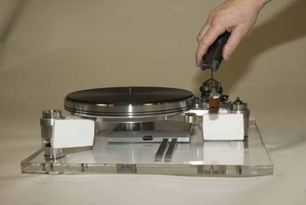 The tonearm installation and calibration will be easier and safer with the sub chassis resting on the foam shipping blocks as described earlier. The drive belt should not be used for this operation.