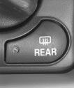 Rear Window Defogger Press the button marked REAR to turn the rear window defogger on. An indicator light will glow when the rear window defogger button is on. Press the button again to turn it off.
