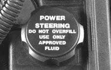 Radiator Pressure Cap NOTICE: Power Steering Fluid The power steering fluid reservoir is located toward the rear of the engine compartment, on the passenger s side.