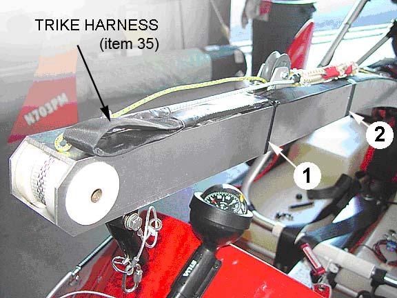 3 Place another end of 90 Trike Harness on trike mast tube and secure with two10