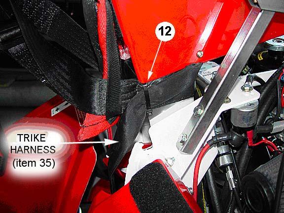 12 Use one 10 Cable Tie (item 26) and secure 90 Trike Harness to
