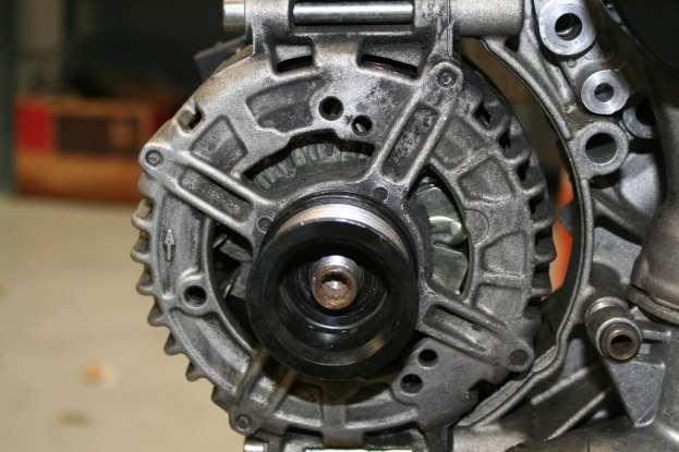x. Remove alternator pulley by using a