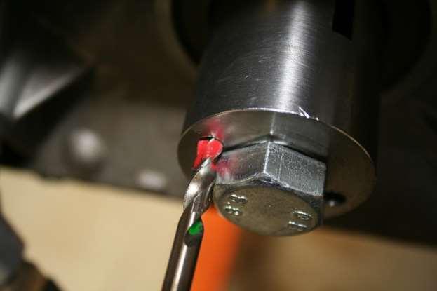 g. Using a Vacuum to vacuum away metal shavings h. Removing Crank Drill tool using a 24mm socket i.