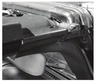 TIP: Make sure the rubber gasket at the top of the windshield is correctly sealed against the front surround