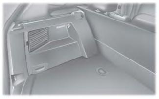 Remove the screws from the splash shield at the wheel well to gain access to the lamp assembly. E162555 1.