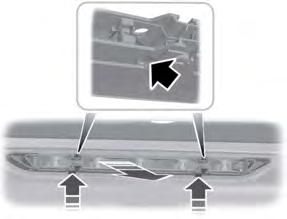 Detach the clips above the inboard side of the rear window. 5. Gently pull the lamp assembly away from the vehicle.