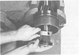 Insert piston into clutch drum using caution as not to damage seals.