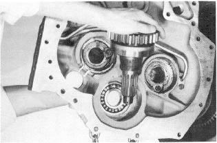 Figure 6 Use a spreading type snap ring pliers to spread the ears on forward clutch