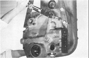 With front cover in position against the transmission case