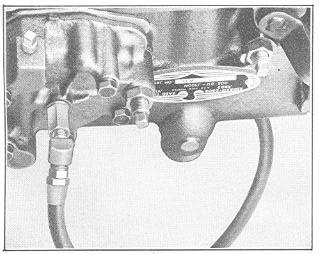 96 AUTOMATIC TRANSMISSION fitting, Figure 151, at this point. FIGURE 152 FIGURE 151 3. Connect a tachometer to the engine. 4.