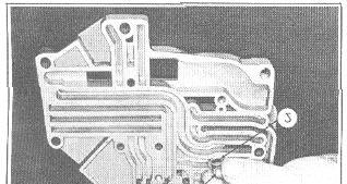 44 AUTOMATIC TRANSMISSION 12. Turn the selector valve (1), Figure 68, so that the milled slot is away from the selector valve detent ball (2) and spring. FIGURE 66 9.