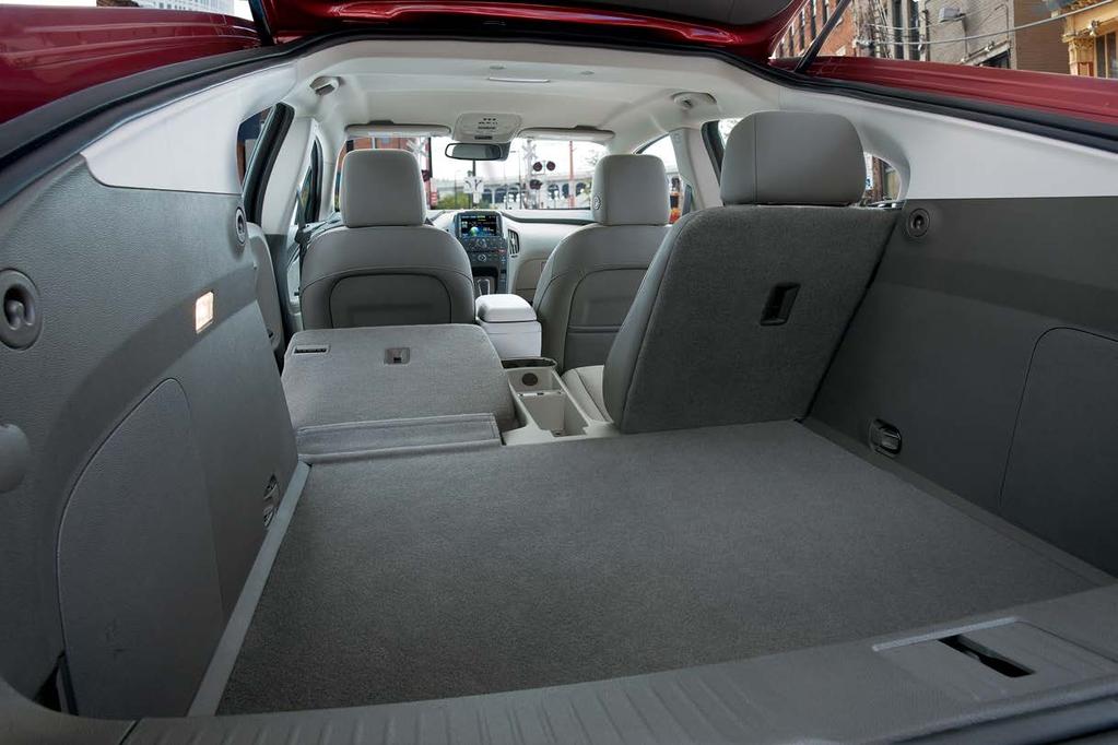 You ll find cupholders, storage bins, door panel storage, and even an umbrella pocket and a dedicated space for the standard 120-volt charging cord.