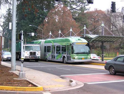 Vehicles Figure 12 EmX Median Station Illustrating Left Side Bus Doors (Source: Lane Transit District) The EmX uses a fleet of six 63-ft articulated low floor buses with a modern, sleek silhouette