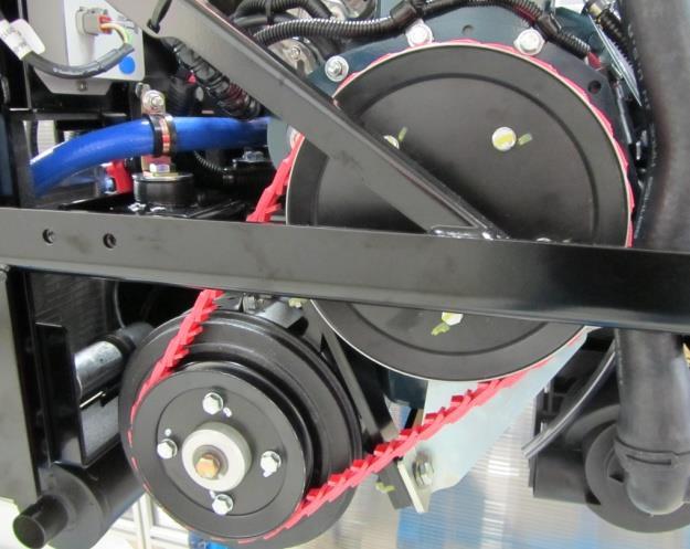 With the belt securely in the pulley grove, turn the crankshaft until the tool rotates to the bottom lifting the belt onto the pulley (Figure 9)