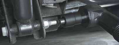 Hold socket fits over bolt and prevents it from rotating. Tool is pushed down and started until drive socket engages and tightens nut.
