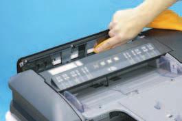 Lift up the document feed tray. 2. Using a soft cloth dampened with alcohol, wipe the roll.