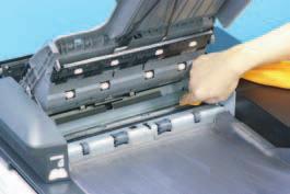 Using a soft cloth dampened with alcohol, wipe the roller. A01HF2C019DA 3. Lift up the document feed tray. 4.