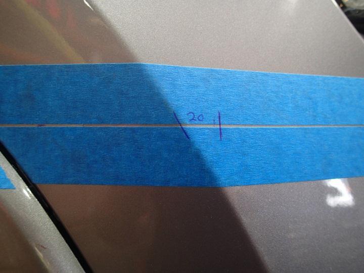 Using masking tape, mark a line following the horizontal feature line (corner) on the