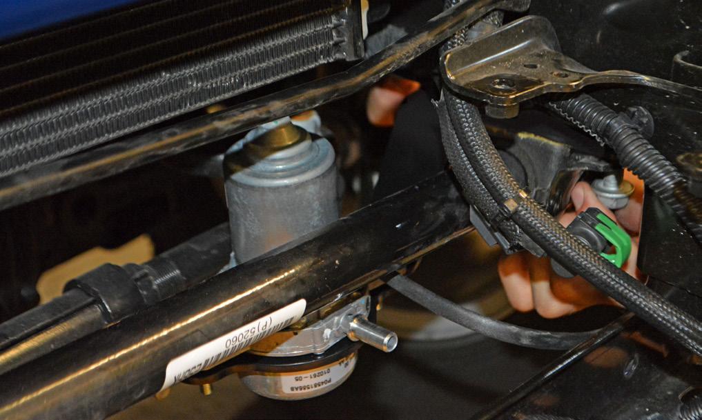the passenger side frame rail, and insert the swaybar spacer in between the