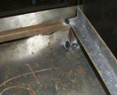 Spot weld the oven chamber flange to the oven with the