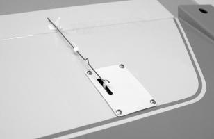 Turn the wing over and use another piece of tape along the hinge line to temporarily "lock" the aileron in this neutral position. Repeat this process with the opposite aileron.