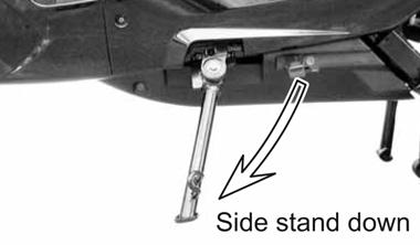 Swing arm bearings should be checked by pushing hard against the side of the rear wheel while the scooter is on the center stand. Free play indicates worn bearings. 3.