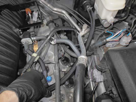 157. Connect the brake booster hose where shown with an arrow using one of the OEM clamps to