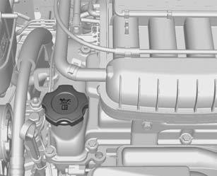 10-10 Vehicle Care The engine oil filler cap is located on the camshaft cover. { Caution Overfilled engine oil must be drained or suctioned out.