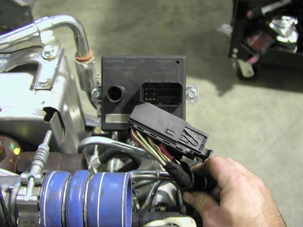Relocate the backside idler pulley to the mount under the AC compressor shown in Figure 2. 7.