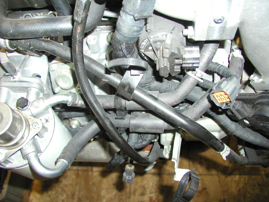 03/24/09 701-900-4290 - INST 21. Find the factory fuel supply line from the filter housing located on the passenger side of the engine, Figure 16.