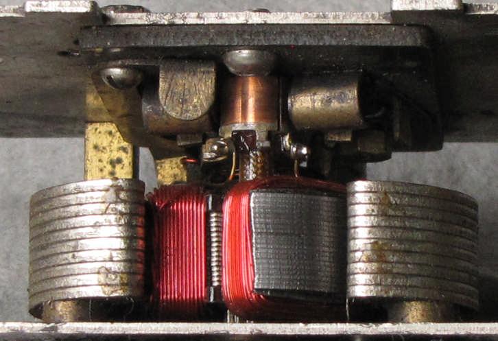 The contact assembly between the pickup assembly and the motor included a spring which sometimes failed from the higher current.