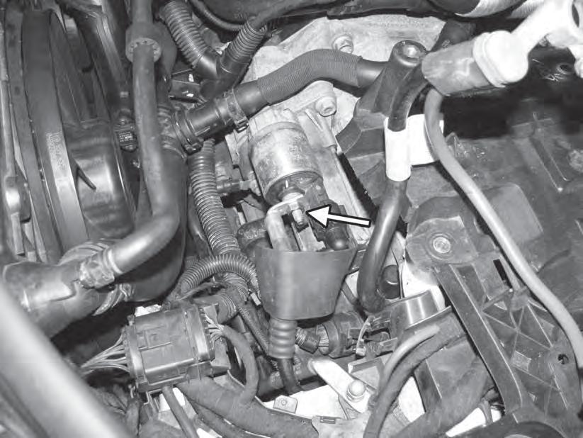 20) On DSG cars, slide back the protective boot on the starter. Loosen the 13mm nut on the power lead to the starter.