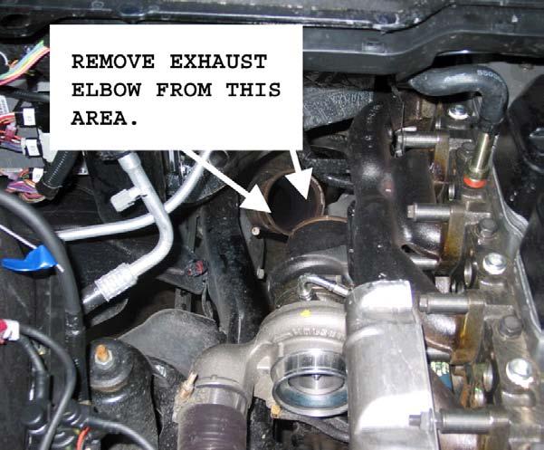 Disconnect the Mass Air Flow sensor harness and remove the plastic turbo air inlet tube.