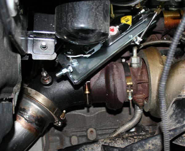 Insert the exhaust brake valve assembly in place of the factory elbow and reinstall the turbo band clamp.
