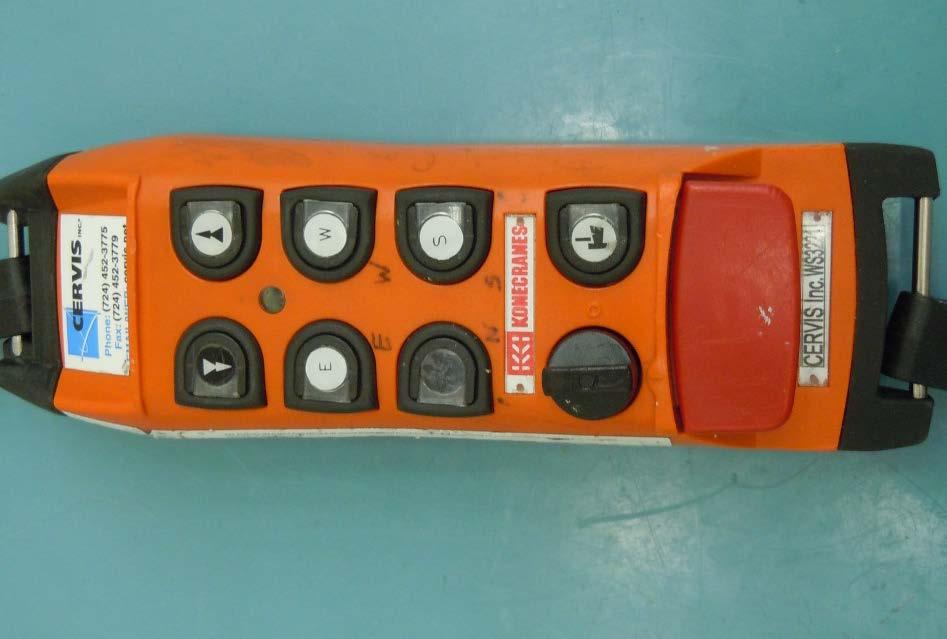 Example of a remote controller labeled with the compass points Move hoist up and down Move trolley east and west Move
