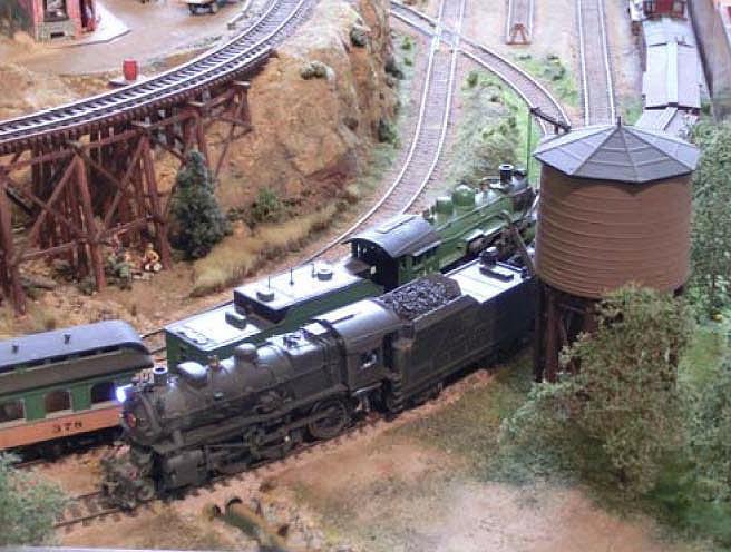 Smaller packages and personal freight is loaded in the baggage combine that G & S brings up the grade. Rail fanning can be good around the water tower situated on the long siding just out of town.