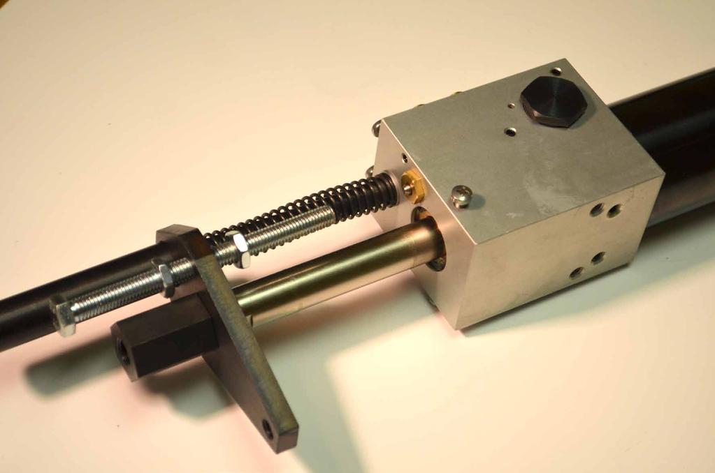 FIG. 18 Feed stroke adjustment screw positioned above auto return valve. Stroke range 5/16" thru 3" (8mm - 75mm).