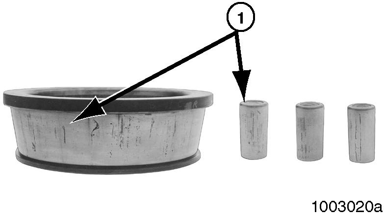Section 3 Preparing the Parts for Assembly f. Damage on rollers and on surfaces of the cup and cone inner race that touch the rollers. Figure 3.4. g.