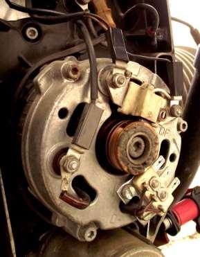 12. Carefully remove the wiring from the alternator stator. 13.