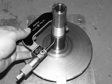 5. Inspect surface of shaft for pitting, grooves, or damage. Measure the outside diameter and compare to specifications. Replace the drive clutch assembly if shaft is worn or damaged.