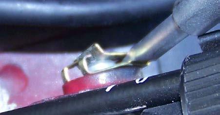 bolt by pushing the center spring up and