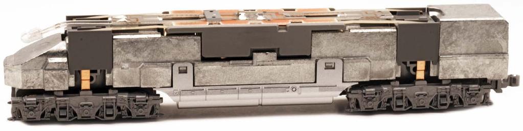 The set includes new tooling cars and EMC-built E5A diesel power. E-units Electro-Motive Corporation early streamline diesel production included Baltimore & Ohio and Santa Fe s E1s Burlington No.