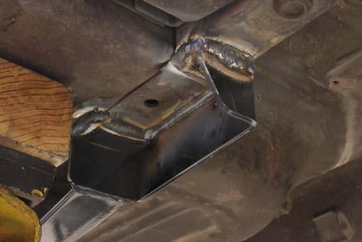 The bent brackets are welded along the bottom of the