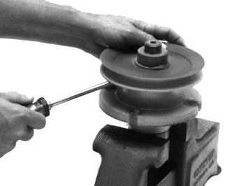 Use caution during disassembly and assembly to avoid damage to the sheave and/or the spindle.