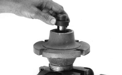 Coat outer surface of bushing with grease before you install it with notch (A) toward bearing. A M37345 B A 9.