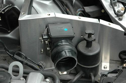the intake 3. Once the intake is in, secure the intake to the car using the supplied 6mm bolts and washers. 4.