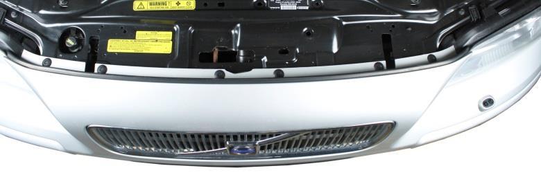 1. Loosen the 6 plastic rivets on top of bumper by pressing the middle