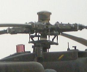 The Extended Forward Avionics Bays (EFAB) of the AH-64D extend forward to the TADS/PNVS and to the rear behind and above the trailing edge of